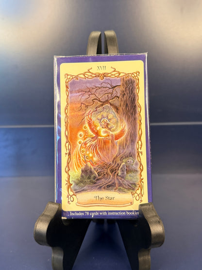 Back of Fantastical Creatures Tarot showing "The Star" on a black stand against a blue background