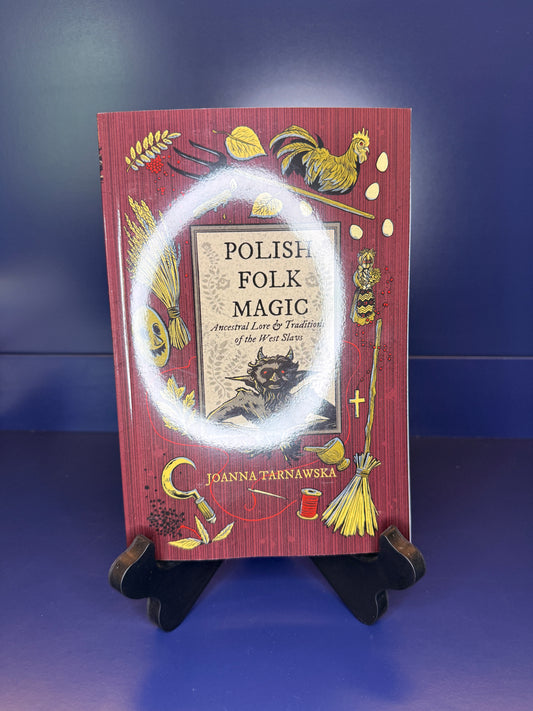 Book titled 'Polish Folk Magic' on a dark blue background
