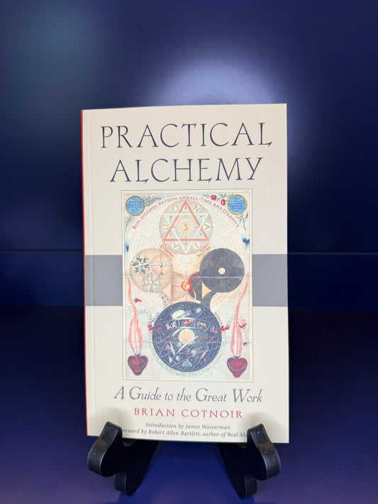 Book titled 'Practical Alchemy' on a blue background