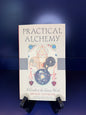 Book titled 'Practical Alchemy' on a blue background