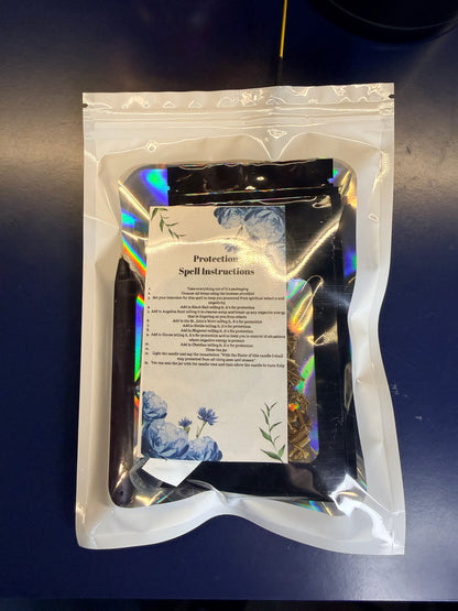 White plastic bag with a clear window showing a piece of decorative paper and smaller pouches on a blue background