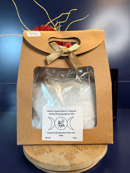 White epsom salt in a brown paper container with a bow, on a wooden coaster