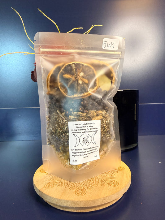 Packaged herbs on a decorative wooden coaster against a blue background