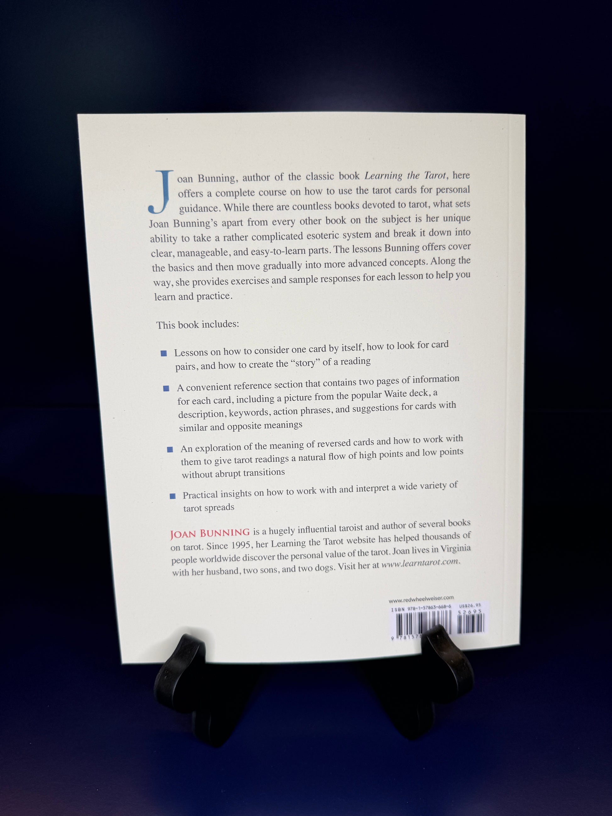 Back cover of a book with text and a barcode on a dark background