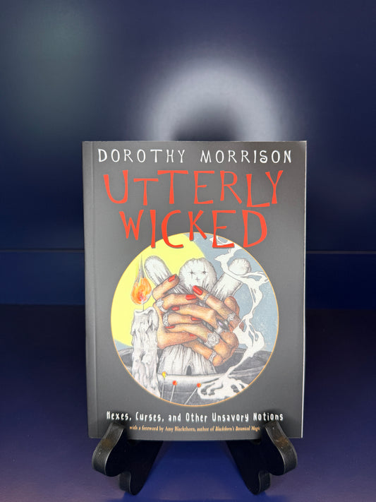 Book titled 'Utterly Wicked' by Dorothy Morrison on a dark background