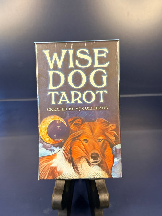 Wise Dog Tarot on a black stand against a blue background